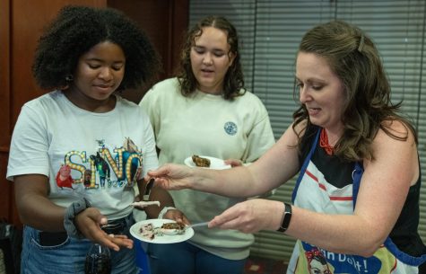 WKU History Department chair Audra Jennings serves up portions of her historical dessert dishes Thursday evening, Sept. 22, 2022 in room 3020 of DSU at WKU in Bowling Green, Ky. during her department’s Great History Bake Off event.