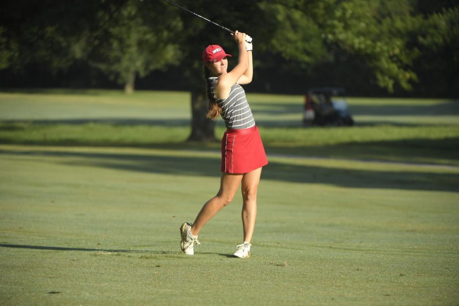 Western Kentucky Hilltoppers women’s golfer Sarah Arnold finishes shot at Olde Stone Country Club. 