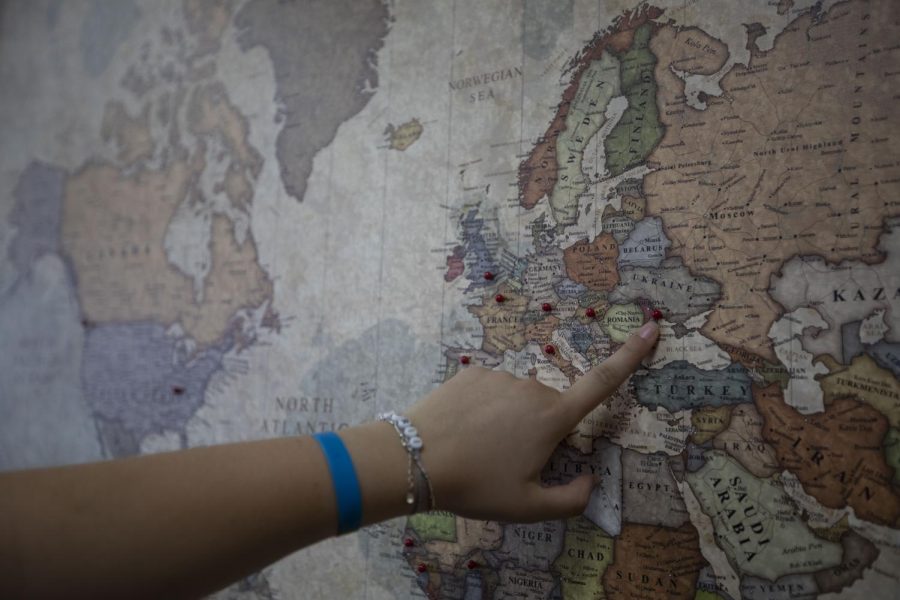 Mariia Novoselia points to her home city of
Odesa, Ukraine, on a map in the Global Agora
in the Honors College and International Center on Oct. 7, 2022. 