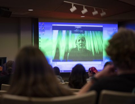 Students sit in the auditorium in Gary Ransdell Hall to hear from Carol Guzy about her work covering the war in Ukraine on Monday, Nov. 14, 2022. Guzy, along with Olga Rudenko, was awarded the 2022 Fleischaker/Greene Award for Courageous International Reporting.