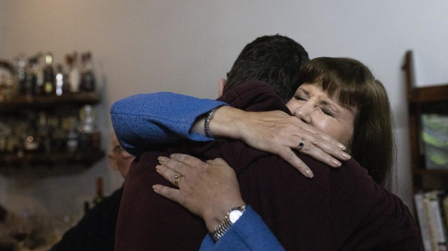 State Representative Patti Minter (D) (right) embraces her son Alex Minter, 17 (left) after giving her concession speech during her election watch party at Preservation Tasting Room in Bowling Green, Ky. on Tuesday, Nov. 8, 2022. Minter was defeated by Republican Kevin Jackson.