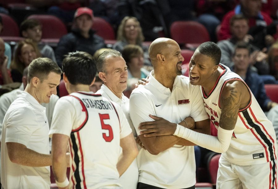 WKU senior center Jamarion Sharp (33) (right) celebrates WKU’s season opener win over Kentucky State University with assistant coach Marcus Grant in E.A. Diddle Arena on Saturday, Nov. 12, 2022. WKU won 127-61.