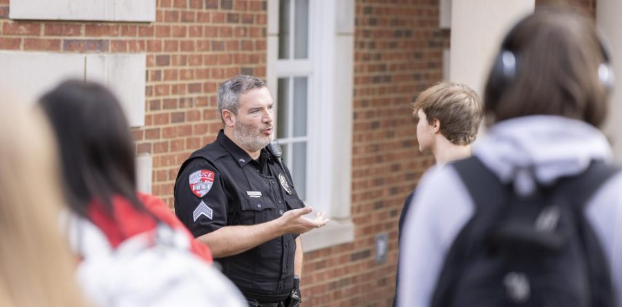 WKUPD officer Brandon Miller speaks with Ethan Denton after he climbed down from the awning he became stranded on at Gary Ransdell Hall on Monday, Nov. 7, 2022. 