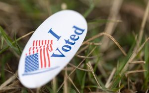 A voting sticker lays forlorn in the grass as early voters in Warren County attend the final day of In-Person No-Excuse Absentee voting for the 2022 Midterm Elections on Saturday, Nov. 5, 2022 at Living Hope Baptist Church in Bowling Green, Ky.