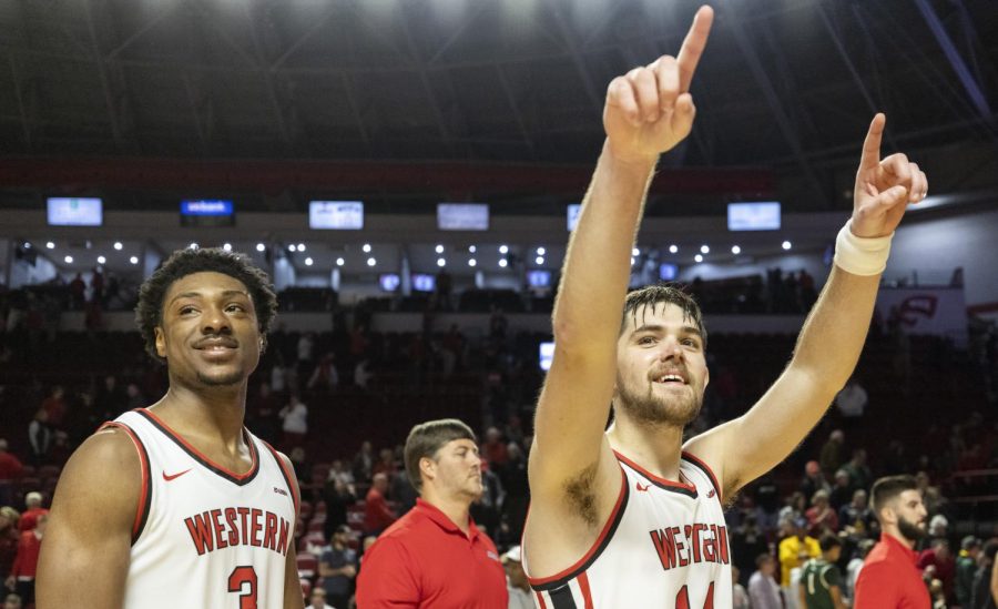 Sixth year guard Luke Frampton (14) (right) motions to the crowd in celebration with teammate fifth year forward Jairus Hamilton (3) (left) after their matchup with Wright State in E.A. Diddle Arena on Saturday, Dec. 10, 2022. WKU won 64-60.