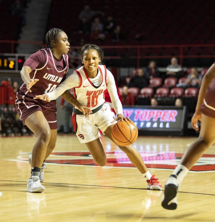 WKU freshman guard Acacia Hayes (10) on a drive against Little Rock in E.A. Diddle Arena on Sunday, Dec. 11, 2022. WKU won 48-25.