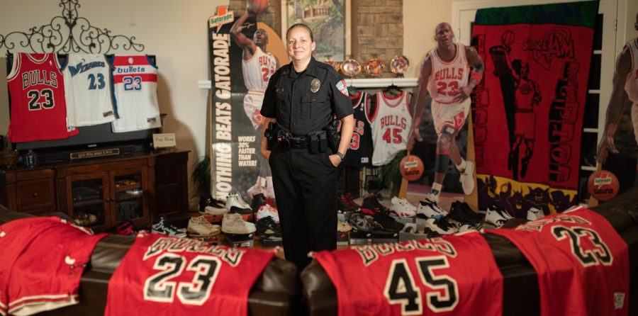 WKU Police Department’s public information officer Melissa Bailey poses for portraits on Friday, Nov. 11, 2022 with her collection of Michael Jordan memorabilia at her mother’s house in Alvaton, Ky.