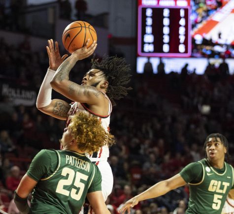 Junior guard Dayvion McKnight (20) puts up a two-pointer during the matchup with Charlotte in E.A. Diddle Arena on Saturday, Jan. 21, 2023. WKU lost 75-71.