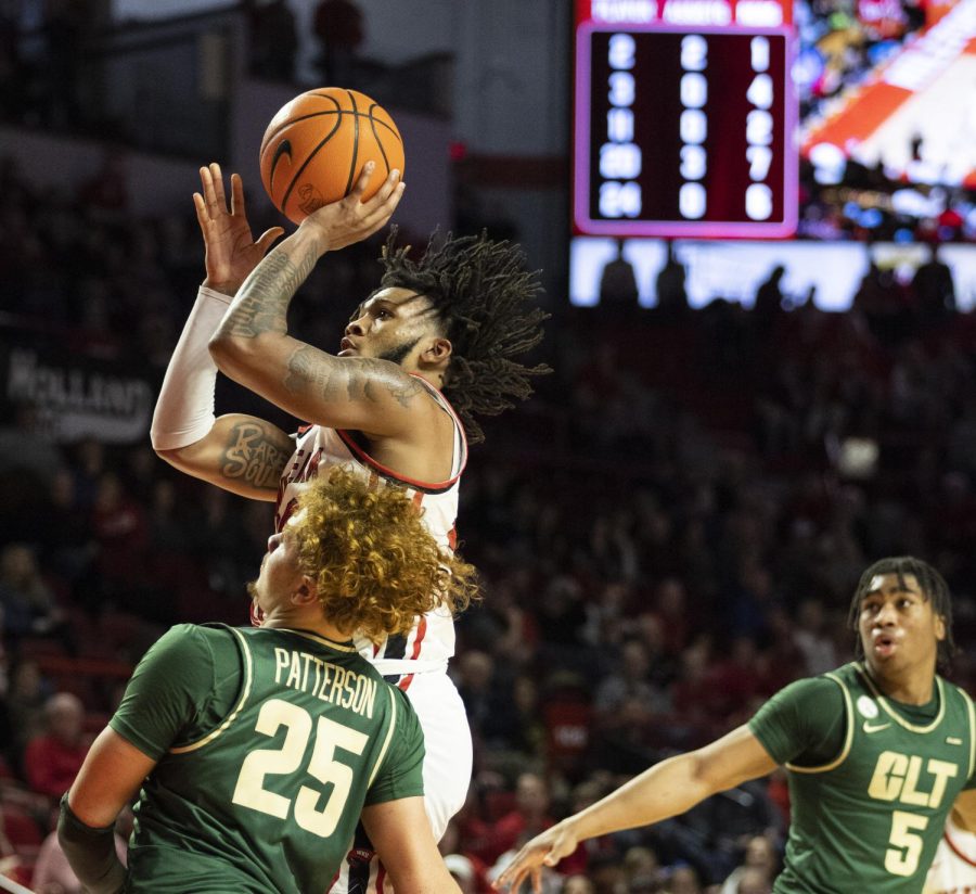 Junior+guard+Dayvion+McKnight+%2820%29+puts+up+a+two-pointer+during+the+matchup+with+Charlotte+in+E.A.+Diddle+Arena+on+Saturday%2C+Jan.+21%2C+2023.+WKU+lost+75-71.