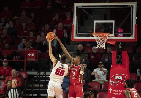 Senior center Jamarion Sharp (33) blocks the attempted shot of FAU’s sophomore center Vladislav Goldin in E.A. Diddle Arena on Monday, Jan. 16, 2023. Sharp made four points, four blocks, and an assist in 25 minutes of play. WKU lost 76-62.