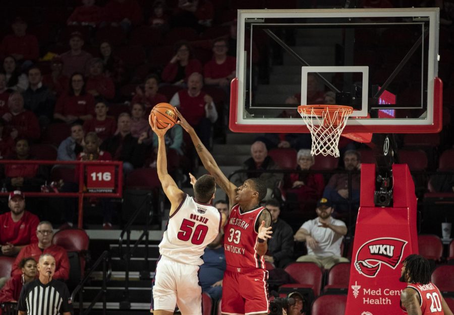 Senior center Jamarion Sharp (33) blocks the attempted shot of FAU’s sophomore center Vladislav Goldin in E.A. Diddle Arena on Monday, Jan. 16, 2023. Sharp made four points, four blocks, and an assist in 25 minutes of play. WKU lost 76-62.