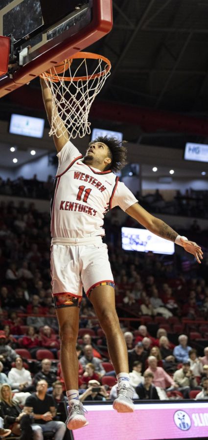 Redshirt+junior+shooting+guard+Dontaie+Allen+%2811%29+makes+an+uncontested+dunk+during+the+matchup+with+FIU+in+E.A.+Diddle+Arena+on+Saturday%2C+Jan.+14%2C+2023.+WKU+won+70-59.