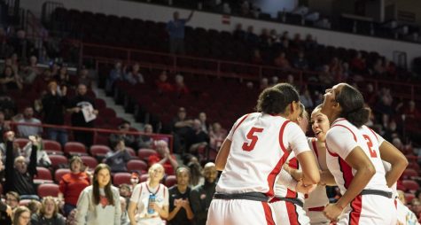 The Lady Toppers huddle and congratulate junior guard Hope Sivori (1) after she made an and one during the matchup with FAU in E.A. Diddle Arena on Saturday, Jan. 28, 2023. WKU won 66-65.