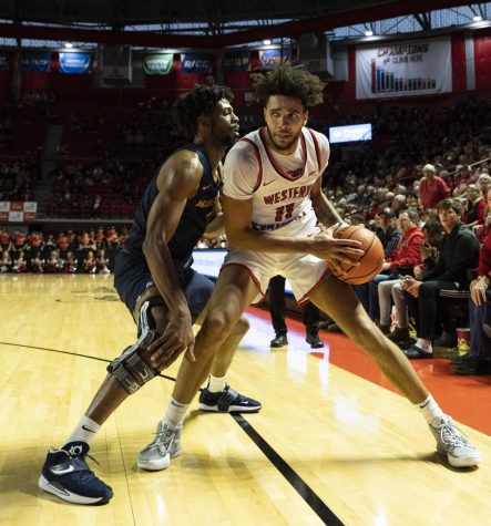 Redshirt junior shooting guard Dontaie Allen (11) guards the ball during the matchup with UTEP in E.A. Diddle Arena on Saturday, Feb. 4, 2023. WKU won 74-69.