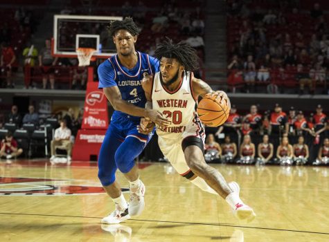 Junior guard Dayton McKnight (20) on a drive during the matchup with LA Tech in E.A. Diddle Arena on Thursday, Feb. 23, 2023. McKnight made three steals and shot seven-for-ten on field goals for a total of 19 points in 34 minutes of play.  WKU won 76-66.