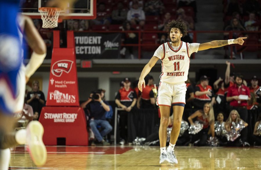 Redshirt junior shooting guard Dontaie Allen (11) points for his teammates to change defensives position during the matchup with LA Tech in E.A. Diddle Arena on Thursday, Feb. 23, 2023. WKU won 76-66.