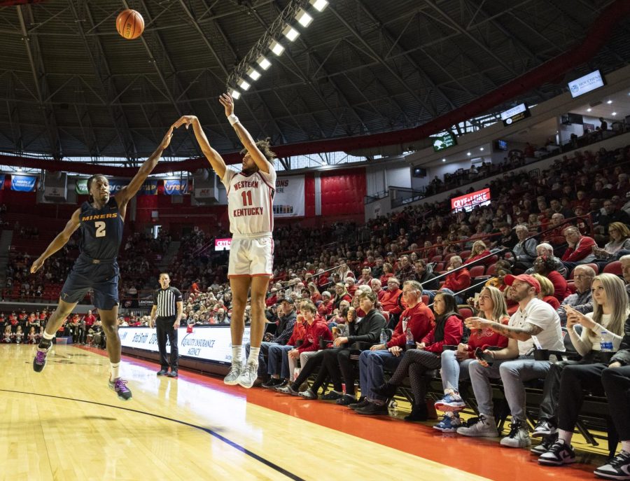 Redshirt junior shooting guard Dontaie Allen (11) shoots a three-pointer during the matchup with UTEP in E.A. Diddle Arena on Thursday, Feb. 4, 2023. Allen shot five for eight on three-pointers and eight for fifteen on field goals for a total of 25 points in 34 minutes of play. WKU won 74-69.