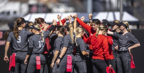 The WKU softball team gathers together before the start of the game against the University of Akron at the WKU Softball Complex on March 5, 2023. WKU won 5-0.