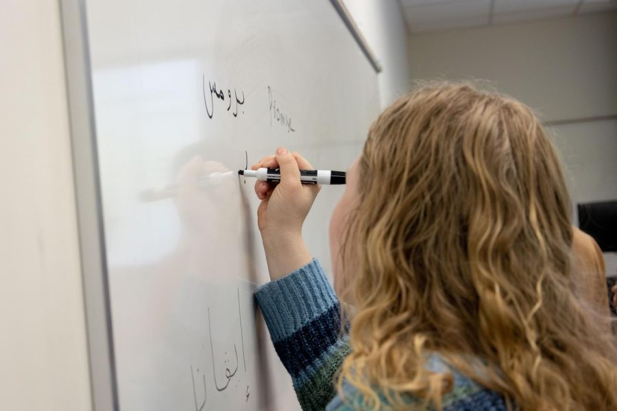 Promise Willhite, freshman Biology major, practices Arabic calligraphy at the calligraphy event Feb. 28. 2023 at the Honors College and International Center.