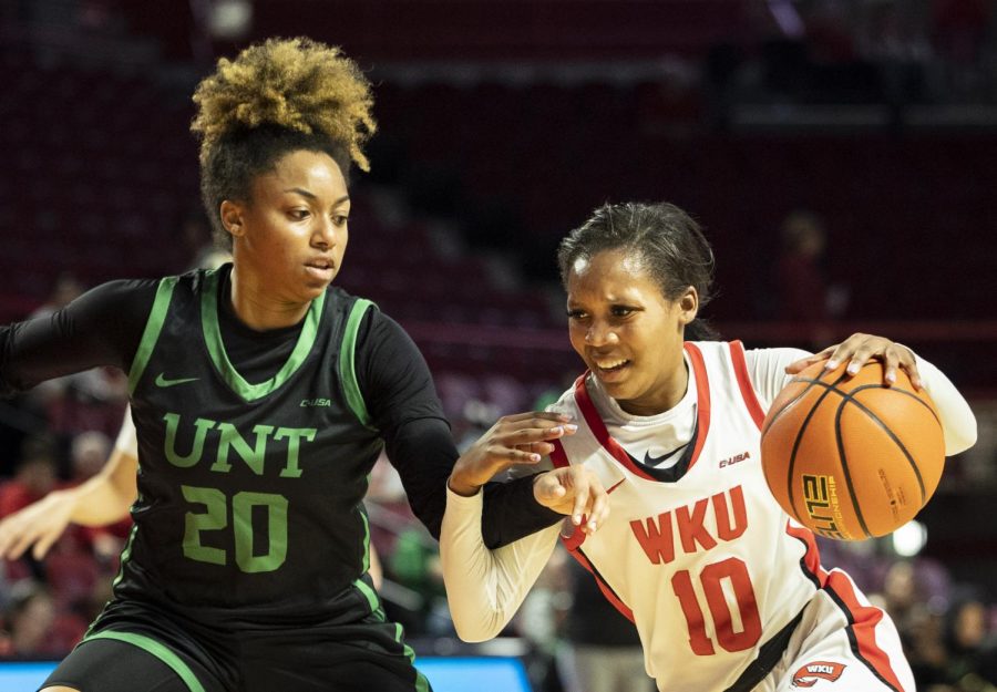 Freshman+guard+Acacia+Hayes+%2810%29+drives+into+the+paint+under+heavy+defense+from+UNT%E2%80%99s+senior+guard+Jaaucklyn+Mallard+%2820%29+in+E.A.+Diddle+Arena+on+Saturday%2C+March+4%2C+2023.+WKU+won+76-67.