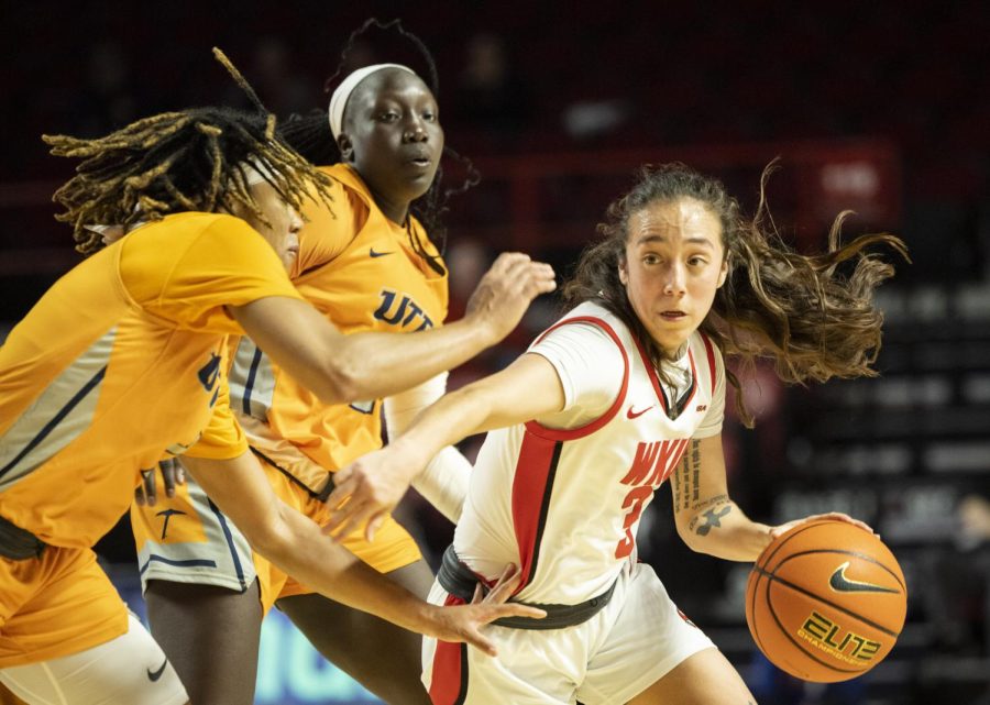 Sophomore guard Alexis Mead (3) drives into the paint under heavy defense from UTEP during their matchup in E.A. Diddle Arena on Thursday, March 2, 2023. WKU won 62-59.