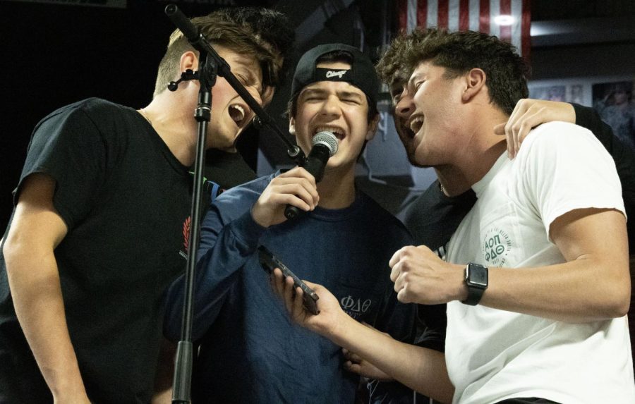 Members of WKU’s Phi Delta Theta fraternity sing Hey There Delilah during the karaoke event at Midnight on The Hill in E.A Diddle Arena on Saturday, March 25, 2023.