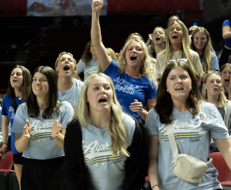 Members of WKU’s Alpha Xi Delta sorority chear their team on during a tug of war match at Midnight on The Hill in E.A Diddle Arena on Saturday, March 25, 2023.