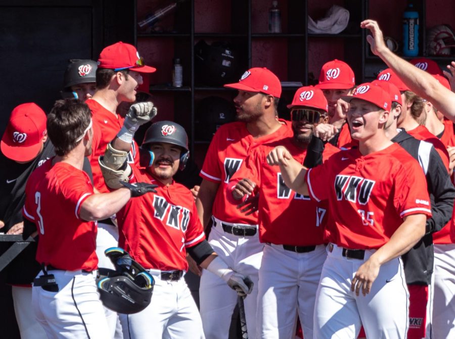 WKU Hilltoppers celebrate a run by redshirt junior outfielder Ty Crittenberger (3) during the first round of a double-header against the NIU Huskies Saturday, March. 4, 2023 at Nick Denes Field. WKU won the first match 9-8.