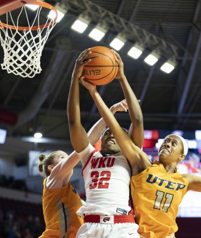 Freshman guard Karris Allen (32) grabs a rebound during the matchup with UTEP in E.A. Diddle Arena on Thursday, March 2, 2023. WKU won 62-59. 