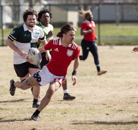 Adam Cowgill drives past defenders in a game against Miami (Ohio) University.

Photo credits to family members of the WKU  rugby club team.