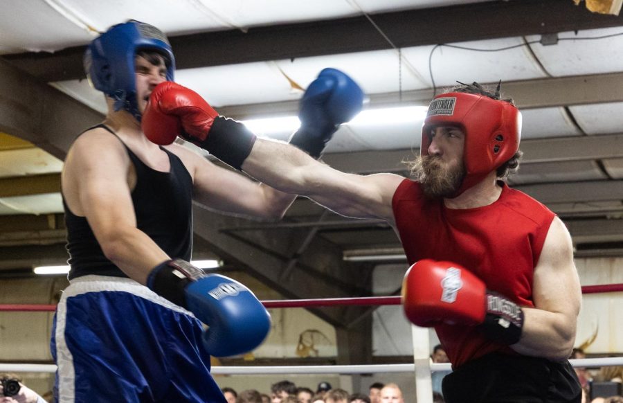 Michael Odenthal (right) lands a punch on Colin Craig (left) during their bout on Friday, March 31, 2023 at Lampkin Park in Bowling Green, Ky. at the WKU Sigma Chi Fight Night event to raise money for Huntsman Cancer Institute. Odenthal won the match. 