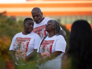 (From to left to right) Ayanna Morgan’s family members Misha Baskerville, Lord Zilverbakk-Omega Prime and Veronica Hiriams embrace during a vigil for Morgan at Guthrie Bell Tower in Bowling Green, Ky. on Tuesday, August 29, 2023. “Just got to keep her (Baskerville) standing, Prime said. Thats my job.