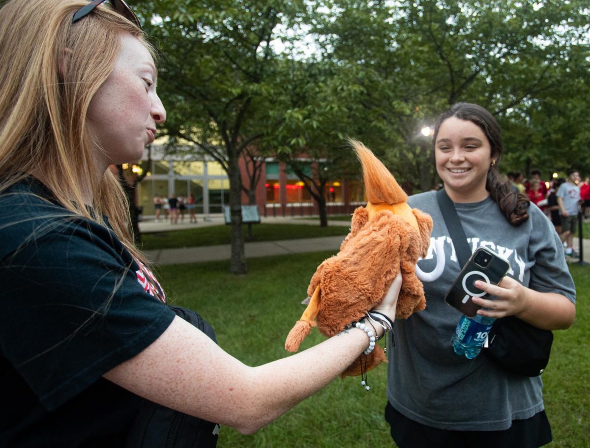 Ariana Baker hands out unstuffed plush mammoths to WKU freshmen during “Create-a-Creature”, part of WKU’s MASTER Plan events, on Aug. 18, 2023 at Centennial Mall.