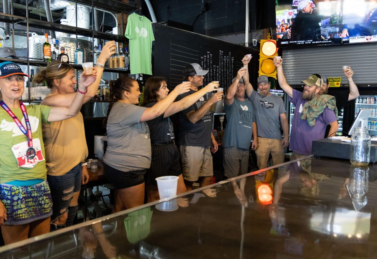 Co-Owner Sean Stevens toasts the opening of White Squirrel Brewery with the brewery staff on Saturday, Sept. 24, 2023. 