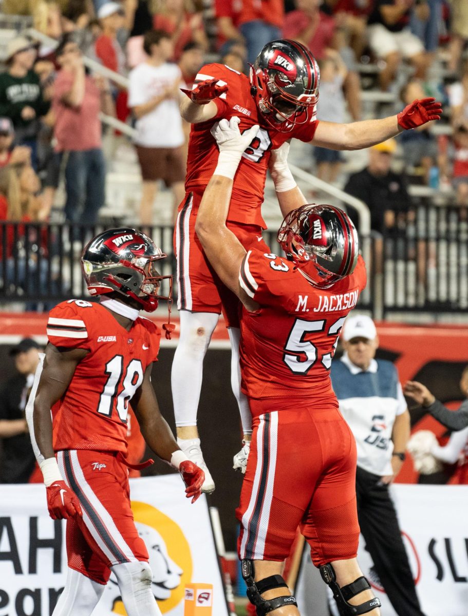 Offensive line Marshall Jackson (53) celebrates after wide receiver Easton Messer (8) scores giving WKU a 16-3 lead against Middle Tennessee on Sept. 28, 2023. 