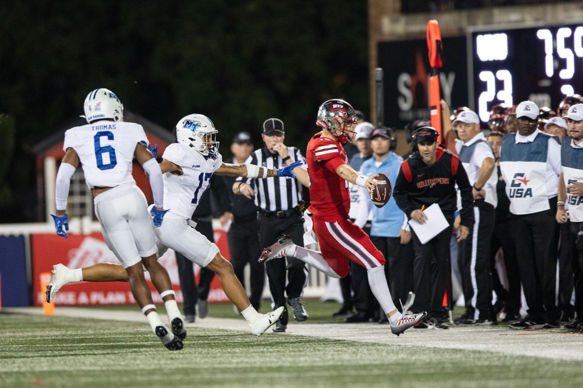 WKU quarterback Austin Reed (16) converts a third down against Middle Tennessee on Sept. 28, 2023 at L.T. Smith Stadium.