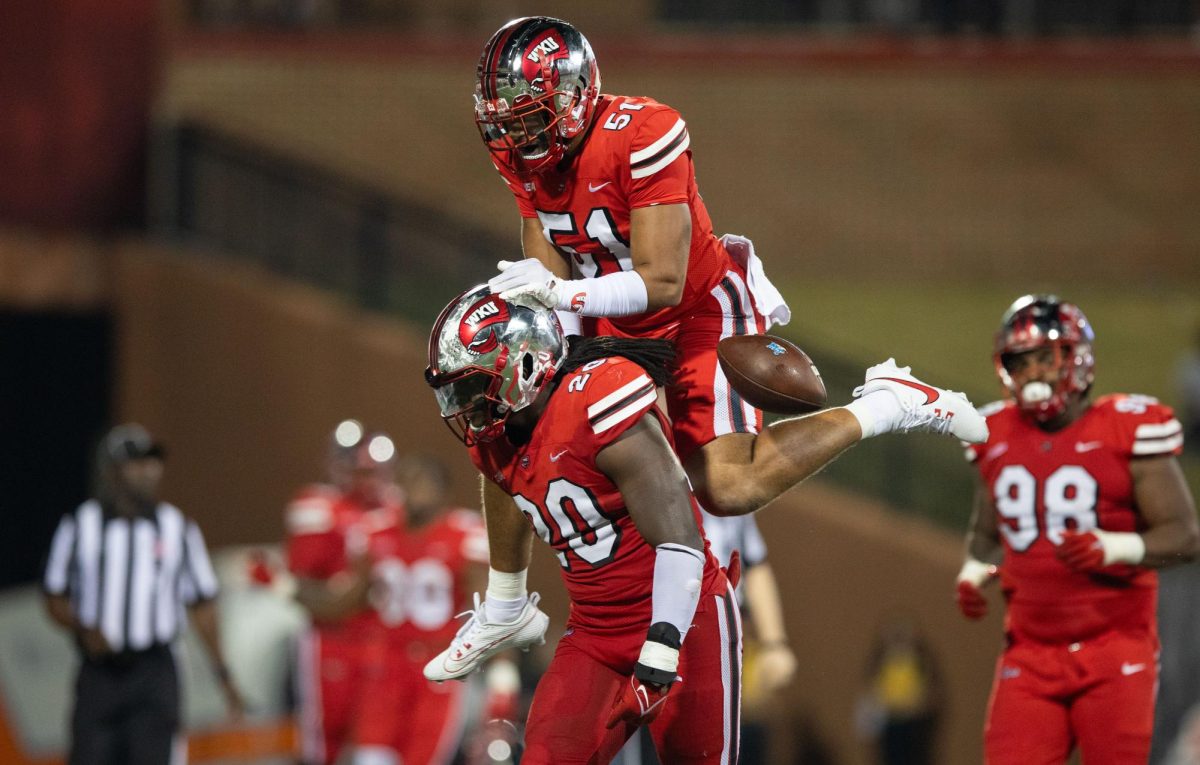WKU linebackers Bryson Washington (20) and Devon Lynch (51) celebrate during the game against MTSU on Sept. 28, 2023 at L.T. Smith Stadium. 