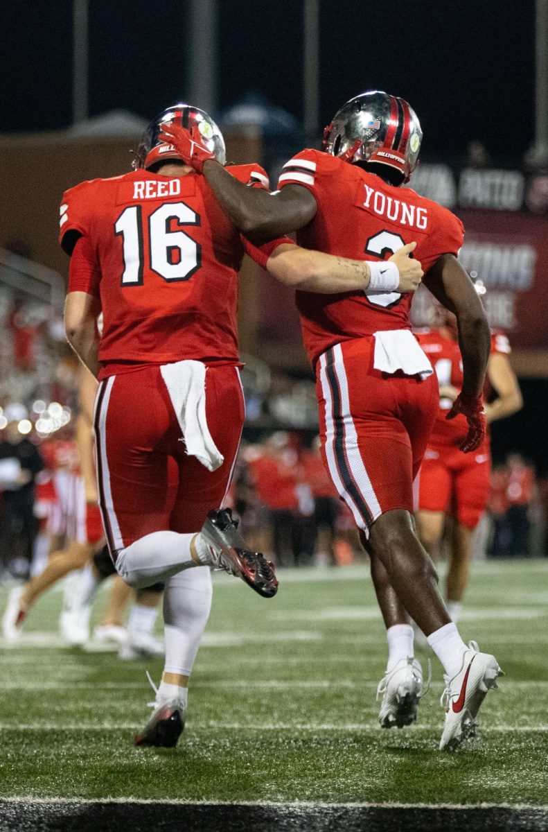 Quarterback Austin Reed, left and Elijah Young, right, celebrate after Reed’s touchdown against Middle Tennessee State University  at L.T Smith Stadium  in Bowling Green on Thursday, Sept. 28, 2023. 