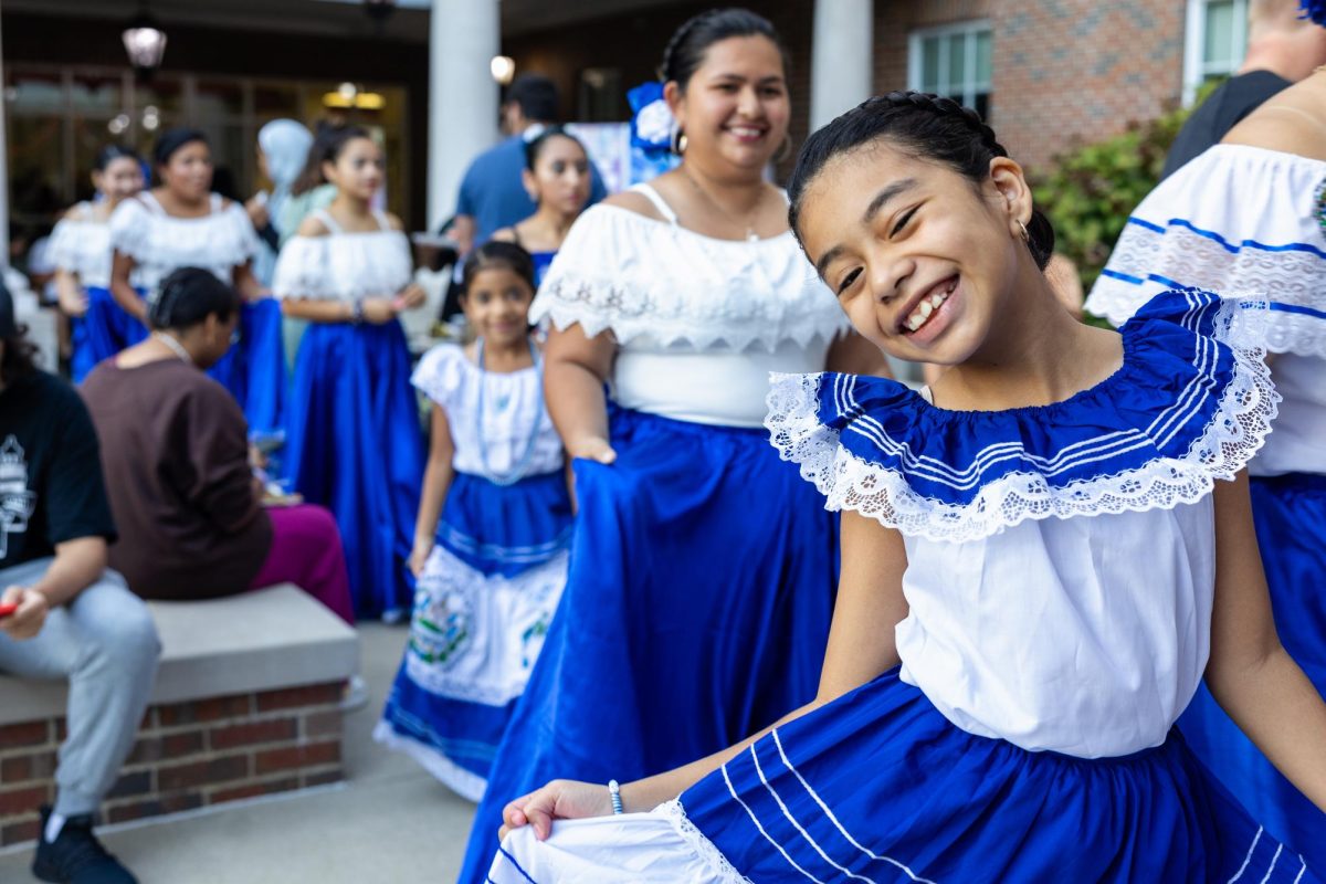 A young El Salvadorian dancer poses before performing at the All Around the World event in the Honors College and International Center on Sept. 14, 2023.