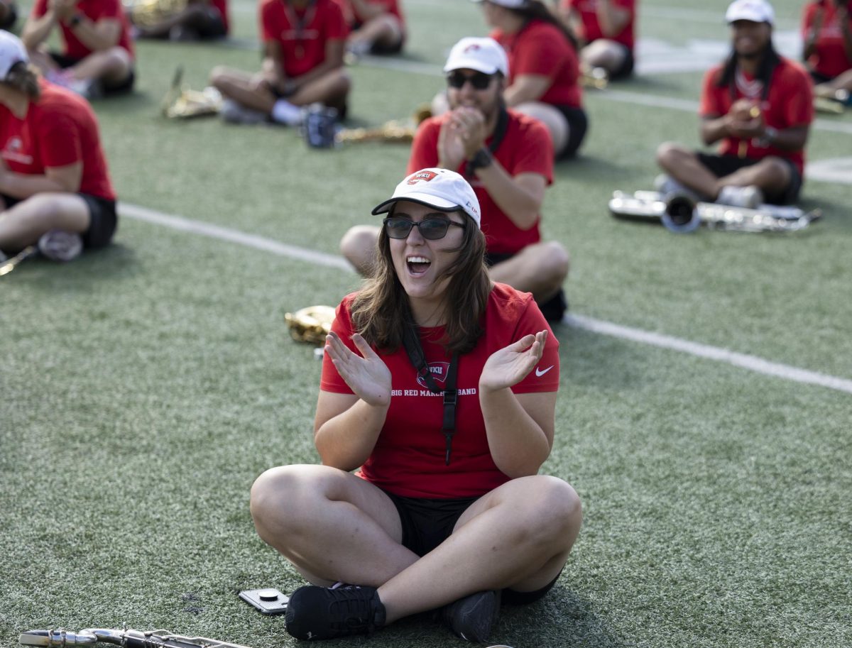 A member of the Big Red Marching Band cheers upon presentation of the invitation to the London New Years Day Parade at the Houchens Industries L.T. Smith Stadium on Monday, Sept. 18, 2023.