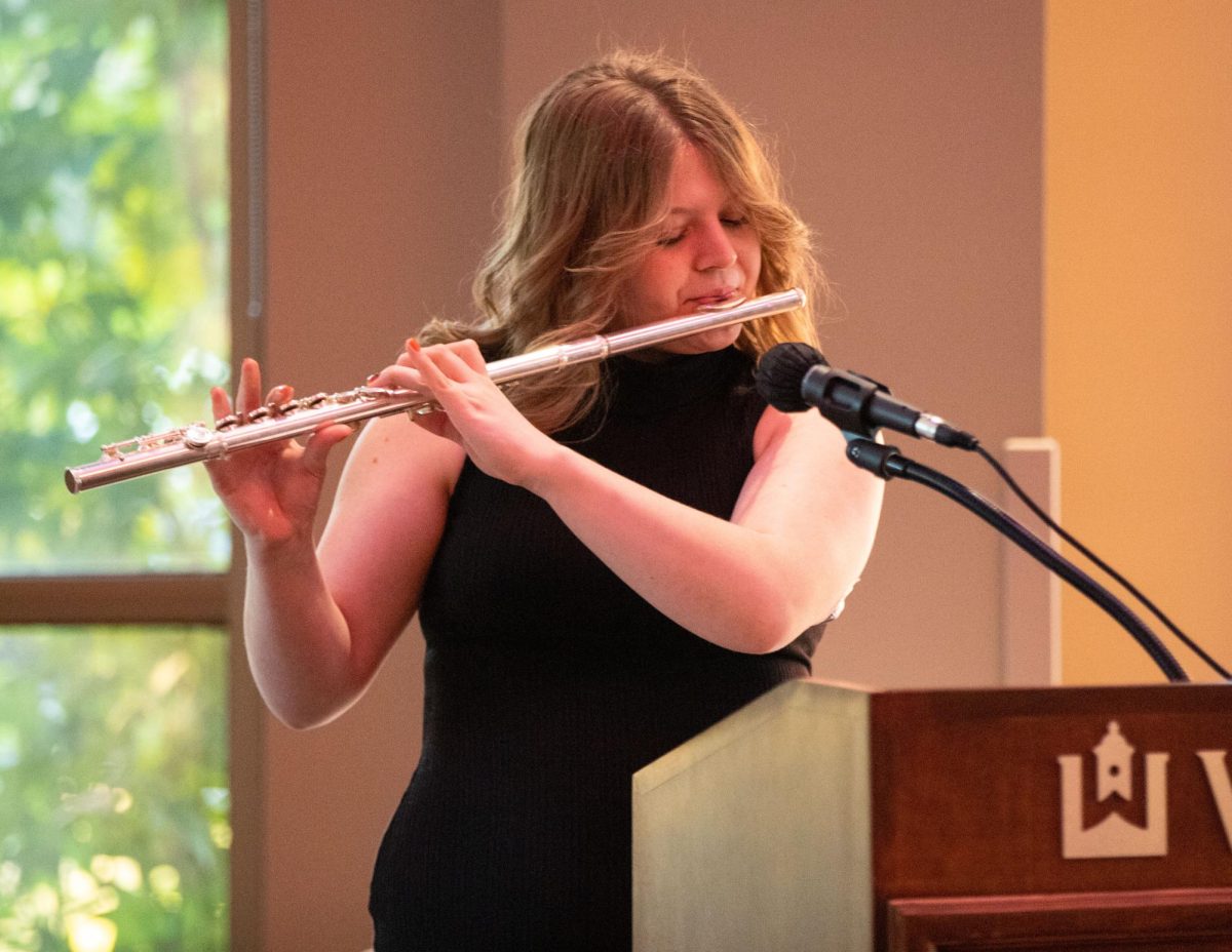 Freshman Myrrisa Belcher performs a Latin Jazz song on the flute during the Hispanic Heritage Month Art Showcase at the Downing Student Union on Monday, Oct. 9, 2023. Belcher performed as part of Professor Yertty Vandermolen’s Spanish 101 class that gave presentations at the art showcase. 