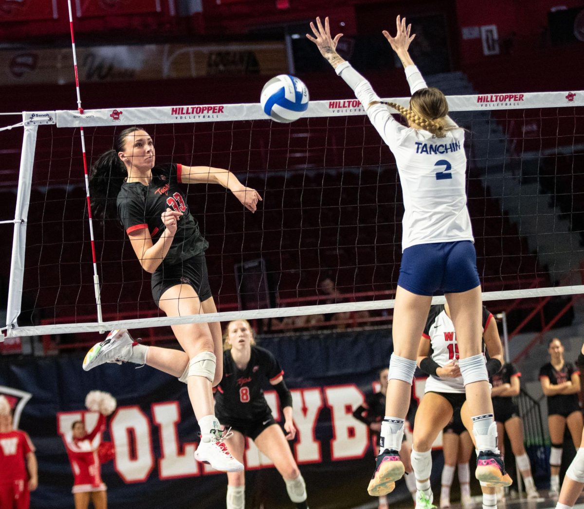 Rightside hitter Kenadee Coyle (33) spikes a ball over the net during a match against Florida International University at the E.A. Diddle Arena in Bowling Green on Saturday, Nov. 4, 2023. 