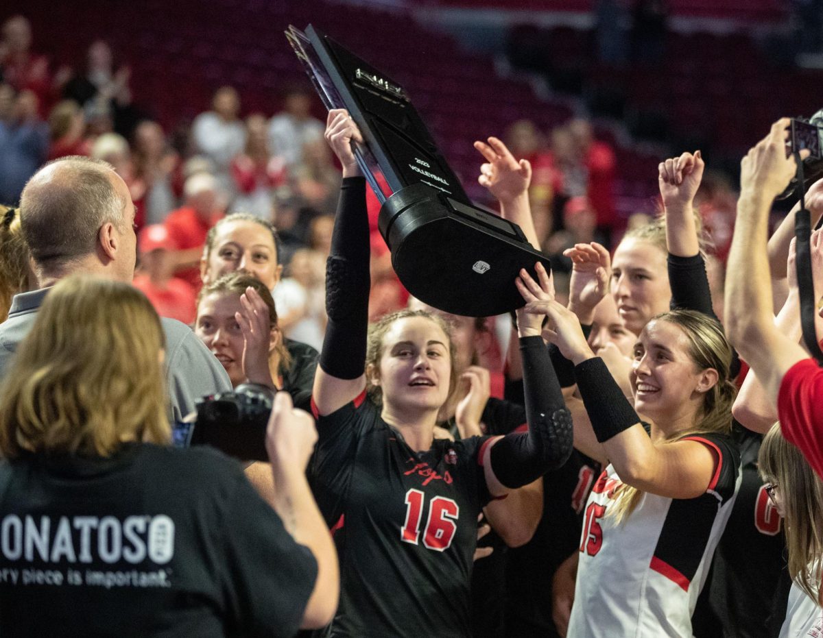 Senior Defensive Specialist Cameron Mosely hoists the C-USA regular season champions trophy after WKU defeated FIU 3-0 at Diddle Arena on Nov. 4, 2023. The teams season ended after a loss to University of Tennessee in the second round of the NCAA Division I Women’s Volleyball Tournament. They ended their 2023 season with a 30-5 record. 