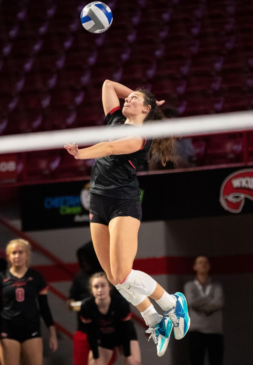 Outside hitter Paige Briggs (1) serves the ball over the net during a match against Florida International University at the E.A. Diddle Arena in Bowling Green on Saturday, Nov. 4, 2023. 