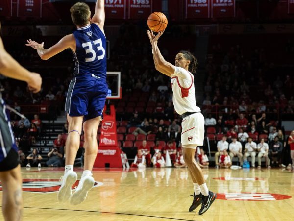 Guard Khristian Lander shoots a three-pointer during a game against the Kentucky Wesleyan College Panthers in the Diddle arena on Monday, Nov. 6, 2023.
