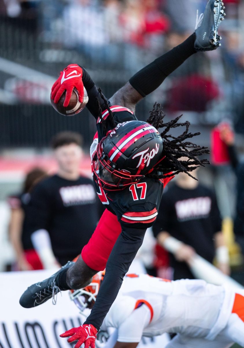 Wide receiver Dalvin Smith (17) jumps over a defender during a game against Sam Houston State University at L.T Smith Stadium in Bowling Green on Saturday, Nov. 18, 2023.