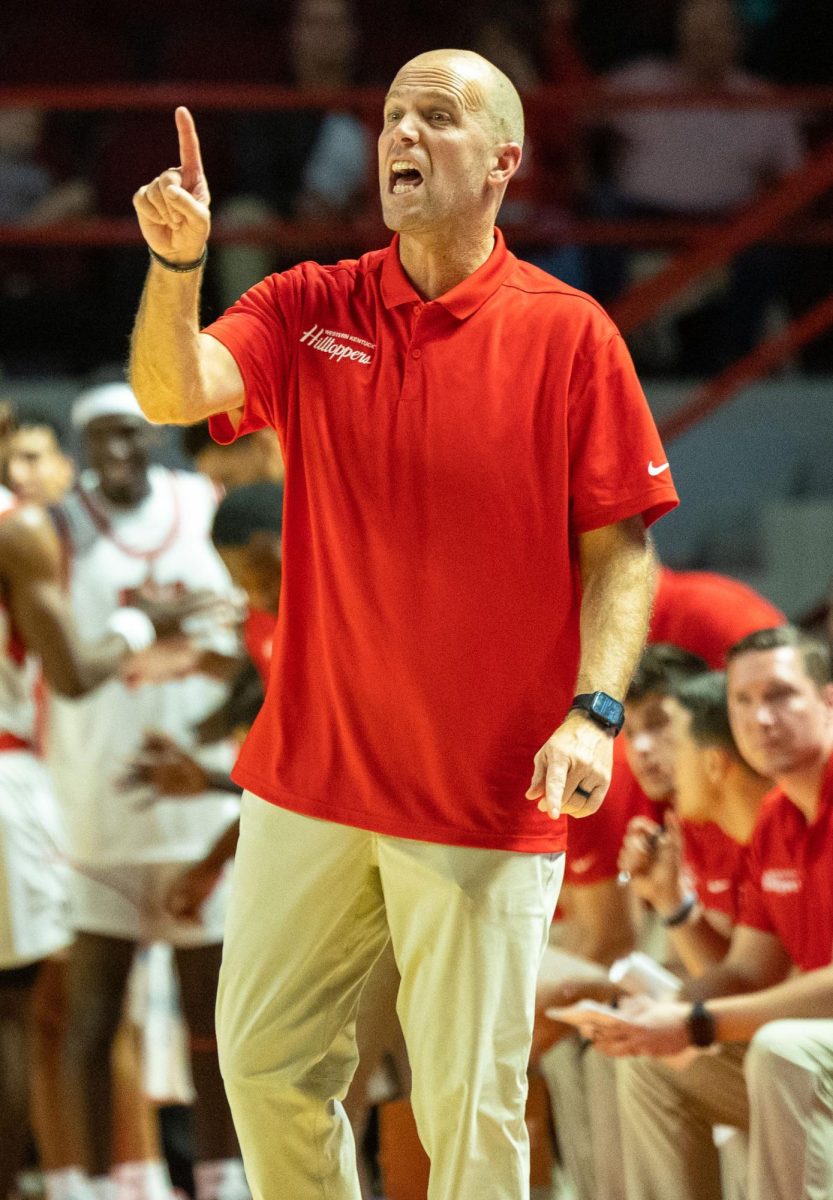 Head coach Steve Lutz talks to his team from the sidelines during a game against the Kentucky Wesleyan College Panthers in the Diddle arena on Monday Nov. 6, 2023. 