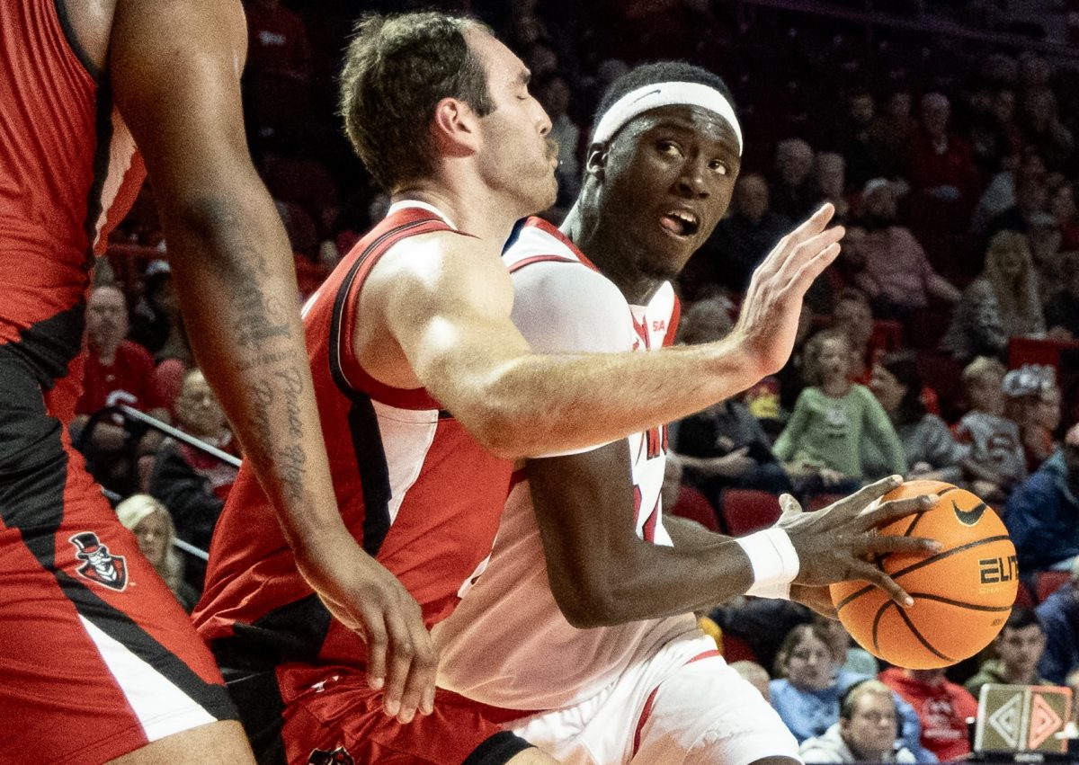 Senior forward Tyrone Marshall Jr. (24) drives the ball past Austin Peay players during a matchup with Austin Peay on Saturday, Dec. 16, 2023.