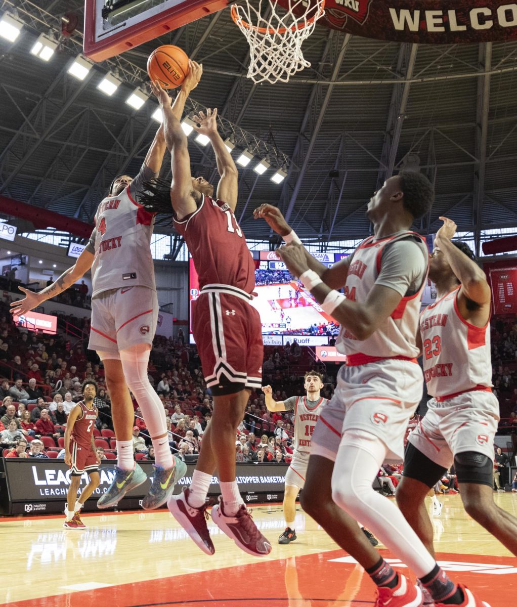 WKU guard Christian Lander (4) competes for a rebound with NMSU guard Jaden Harris (13) in WKU’s Senior Night game in the Diddle Arena on Feb 17.