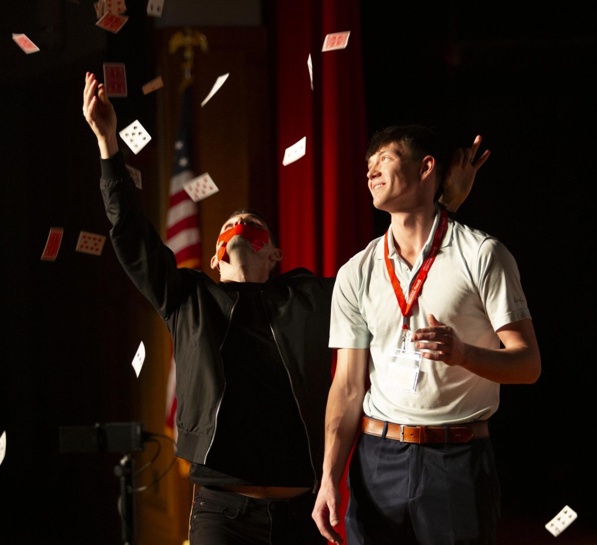 WKU alumni Brice Harney (left) performs a card trick with a crowd member during his magic show at the Downing Student Union on Friday, Feb. 23, 2024. 